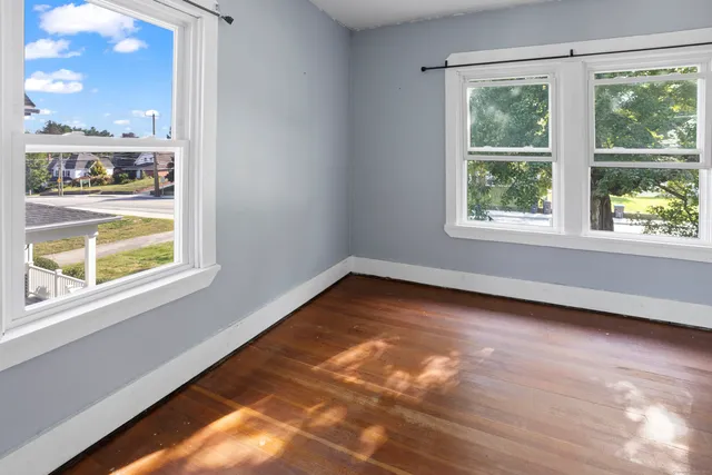 a view of an empty room with a window