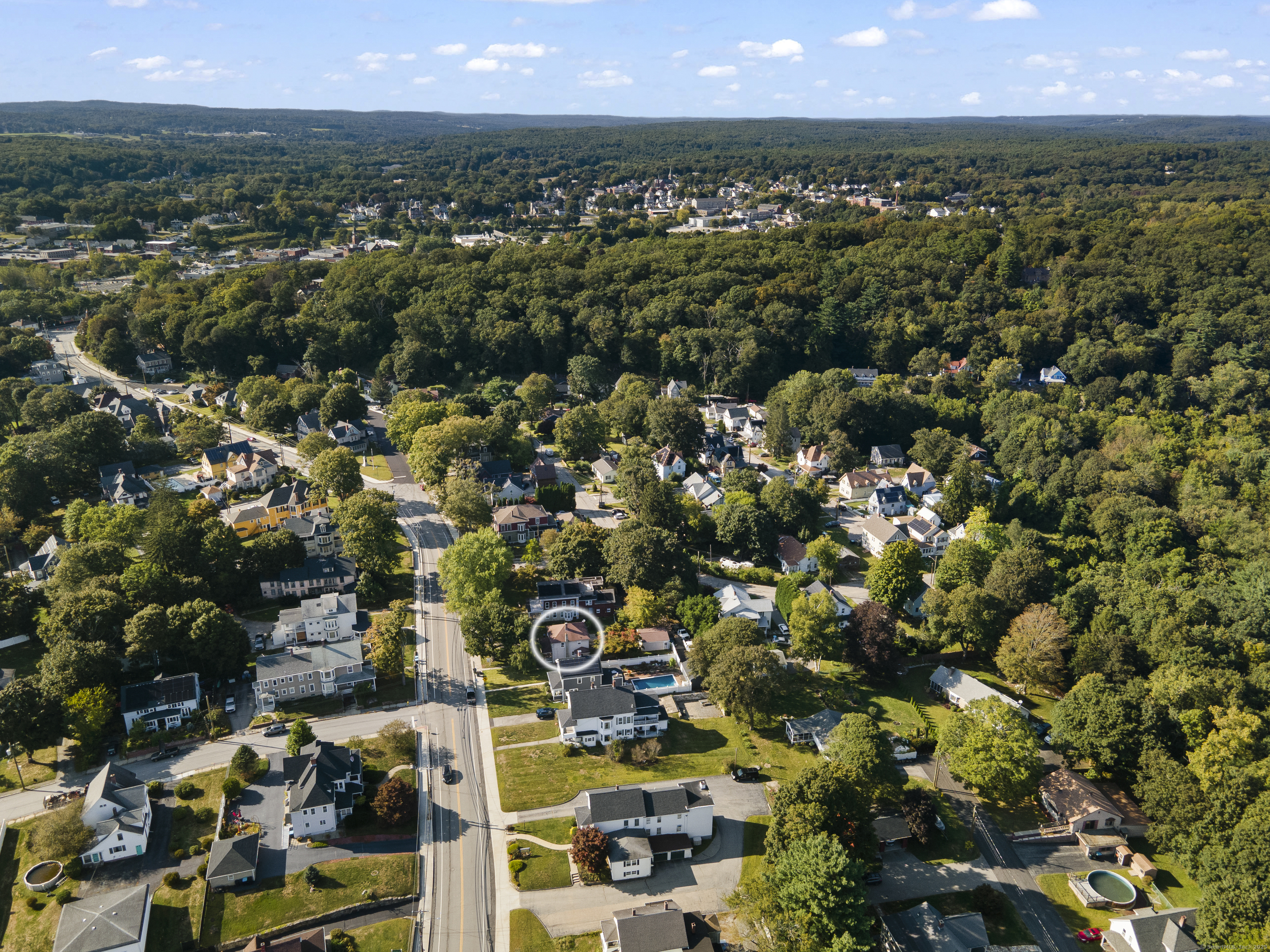 132 Grove Street Putnam, CT 06260 - Photo 4 of 36 an aerial view of residential houses with outdoor space and trees