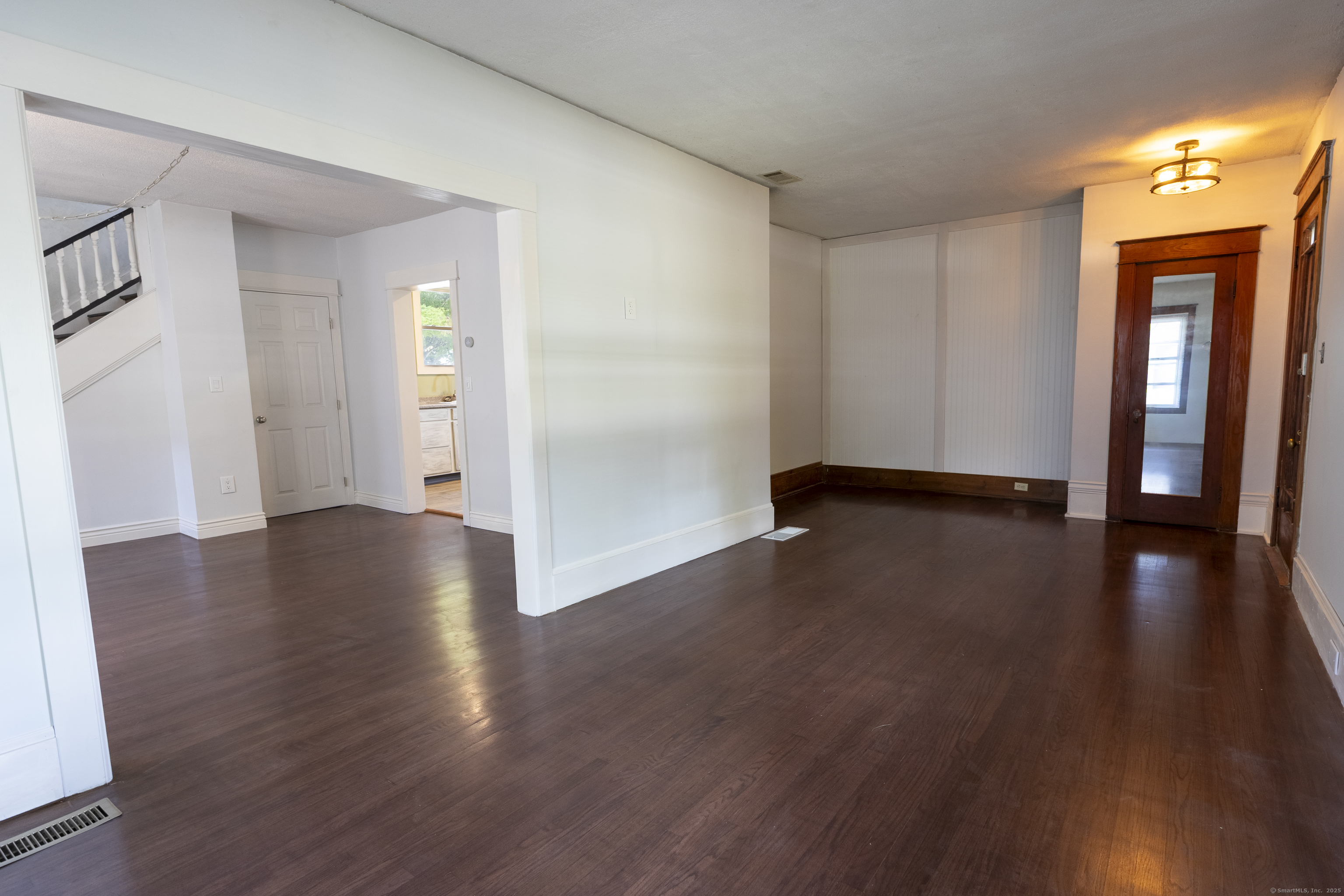 132 Grove Street Putnam, CT 06260 - Photo 9 of 36 a view of a hallway with wooden floor