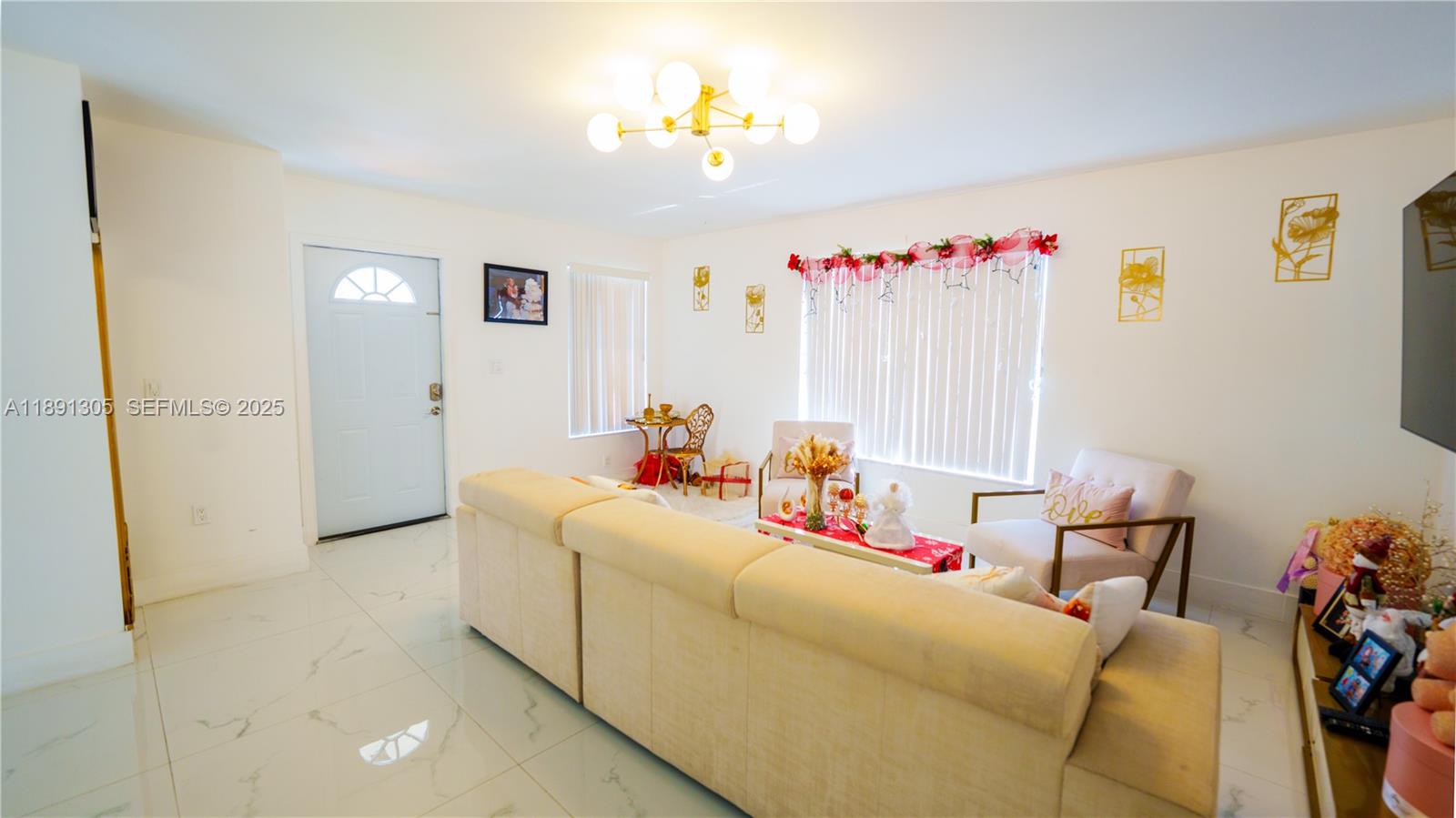 22226 Southwest 98th Place Cutler Bay, FL 33190 - Photo 13 of 29 a bed room with a bed and a chair