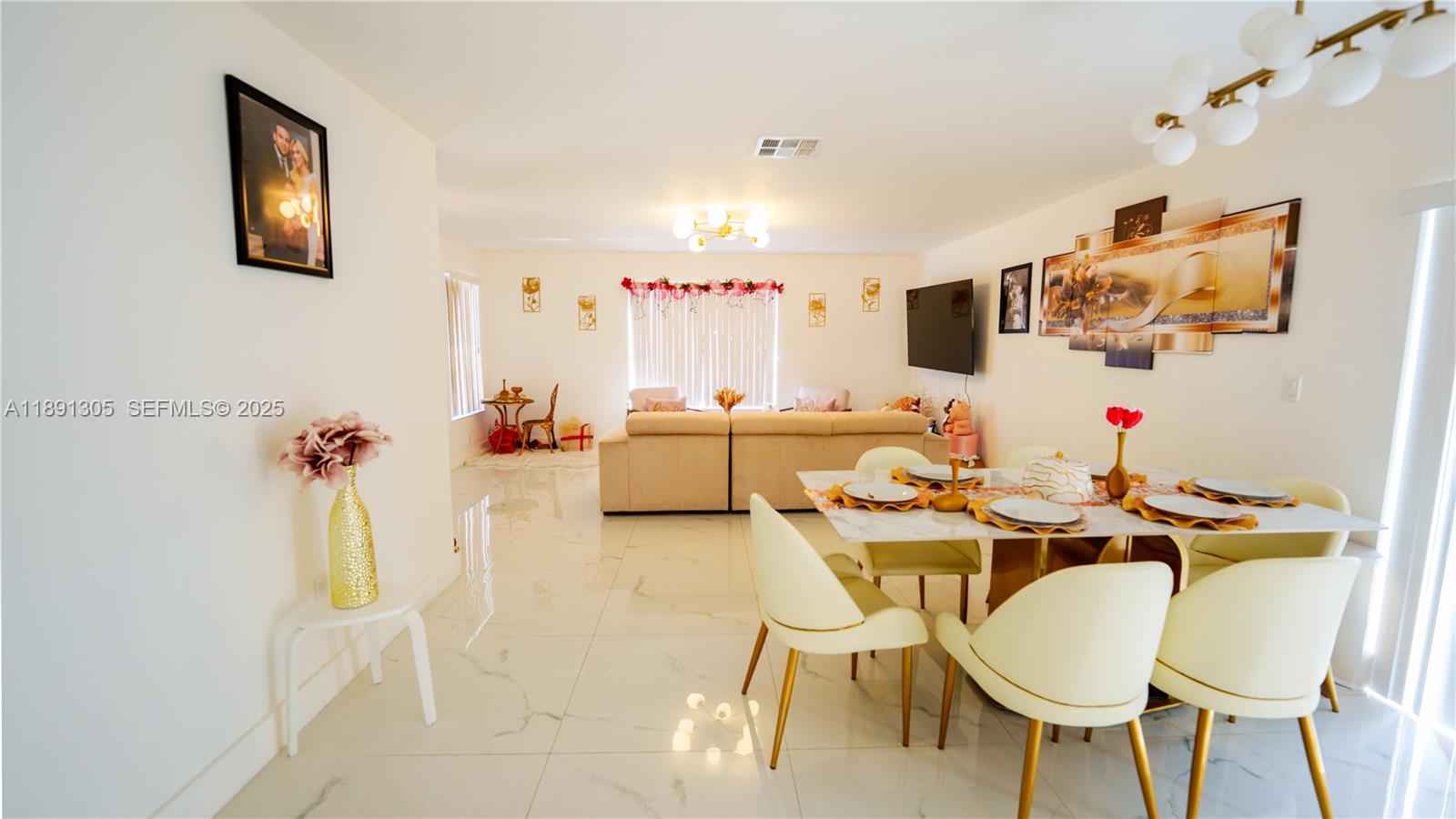 22226 Southwest 98th Place Cutler Bay, FL 33190 - Photo 15 of 29 a living room with furniture and a table