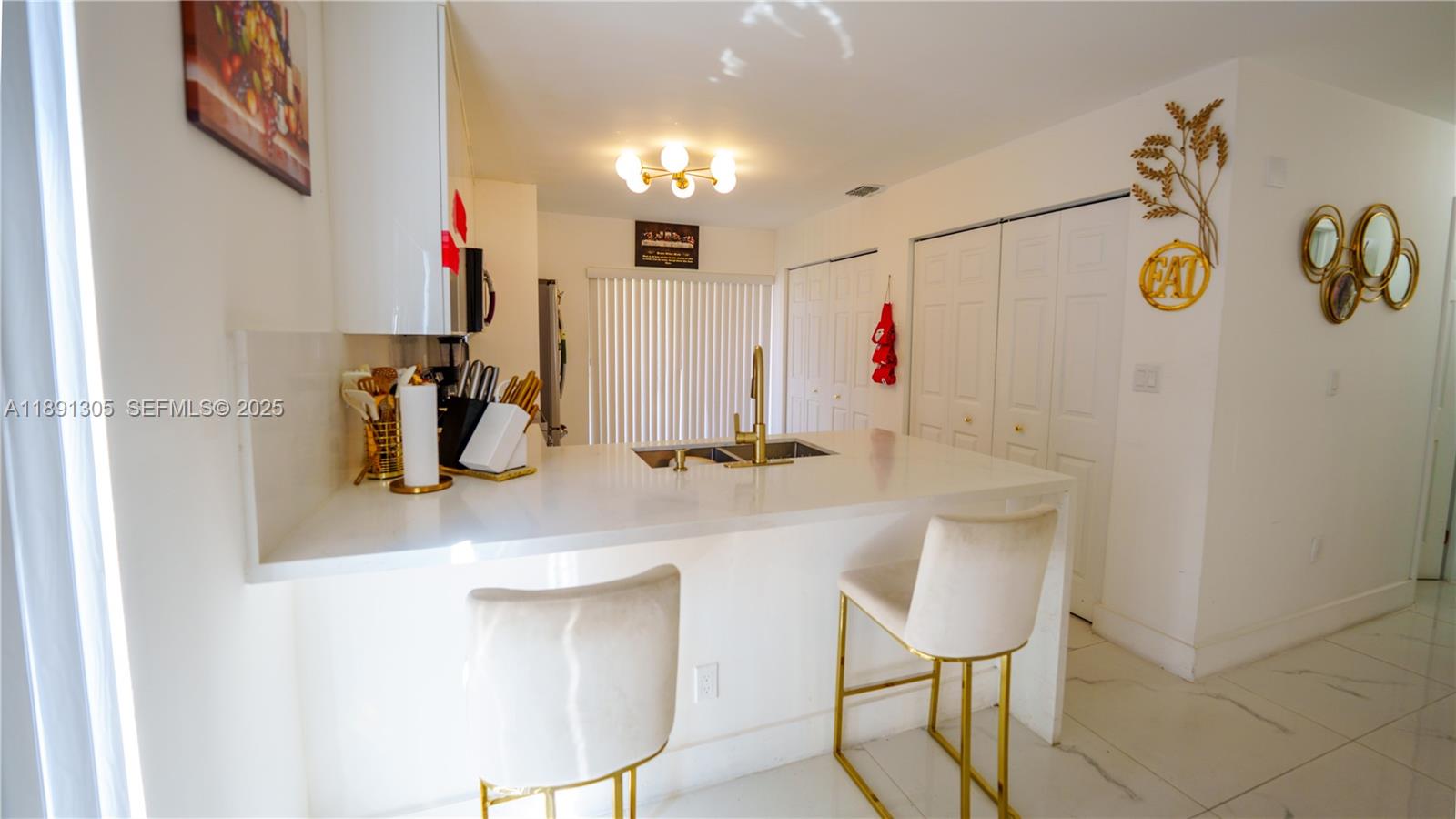 22226 Southwest 98th Place Cutler Bay, FL 33190 - Photo 17 of 29 a bathroom with a sink and a mirror
