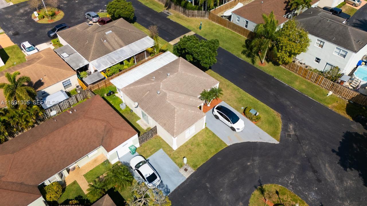 22226 Southwest 98th Place Cutler Bay, FL 33190 - Photo 2 of 29 an aerial view of residential house with outdoor space and swimming pool
