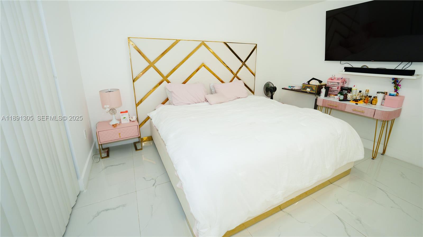 22226 Southwest 98th Place Cutler Bay, FL 33190 - Photo 26 of 29 a bedroom with a bed and a flat screen tv