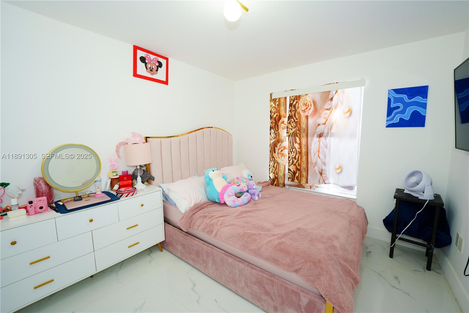 22226 Southwest 98th Place Cutler Bay, FL 33190 - Photo 27 of 29 a bedroom with a bed and dresser