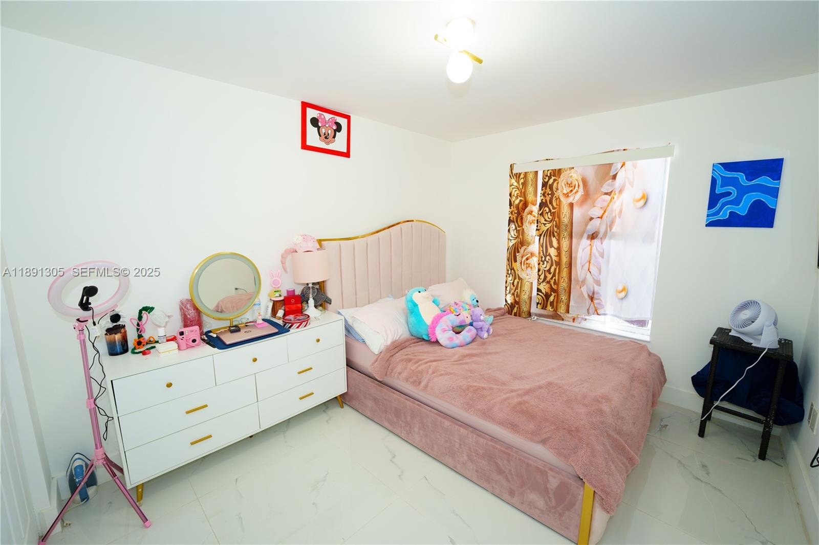 22226 Southwest 98th Place Cutler Bay, FL 33190 - Photo 29 of 29 a bedroom with a bed and a dresser in it