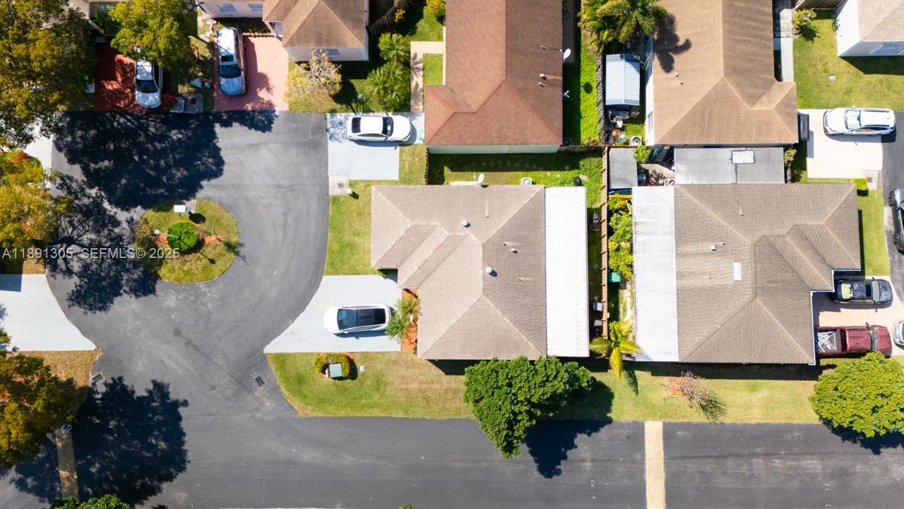 22226 Southwest 98th Place Cutler Bay, FL 33190 - Photo 4 of 29 an aerial view of a house with a swimming pool