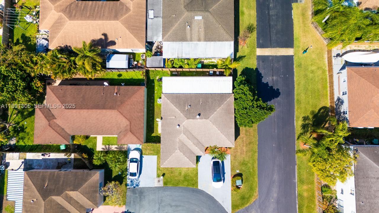 22226 Southwest 98th Place Cutler Bay, FL 33190 - Photo 5 of 29 an aerial view of multiple houses with a yard