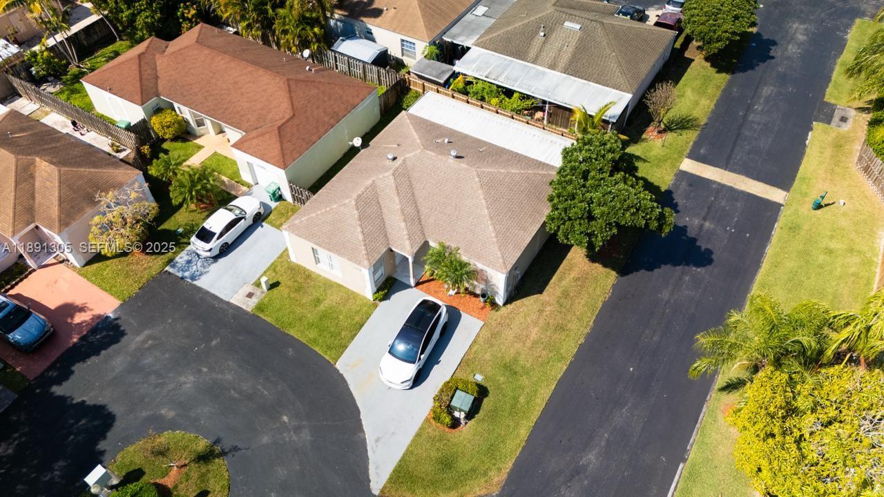 22226 Southwest 98th Place Cutler Bay, FL 33190 - Photo 6 of 29 an aerial view of a house with a swimming pool