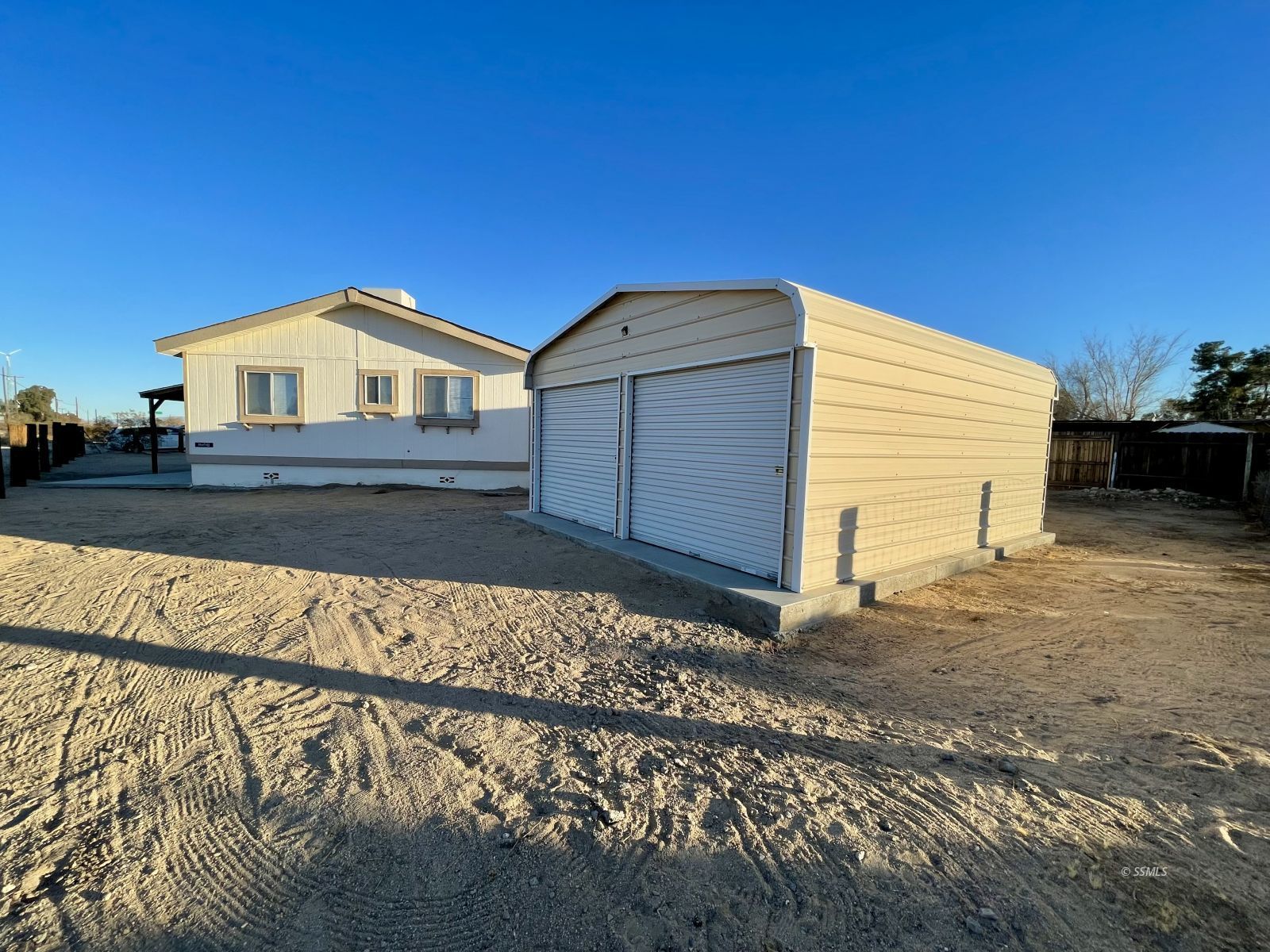 1465 Pony Street Ridgecrest, CA 93555 - Photo 19 of 32 a view of a house with a yard