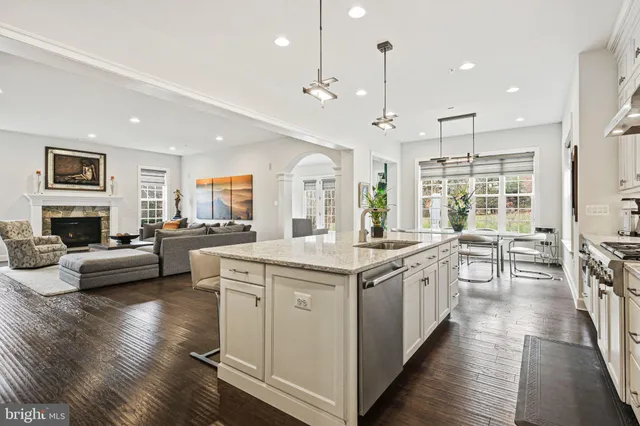 a living room with furniture potted plant and a window