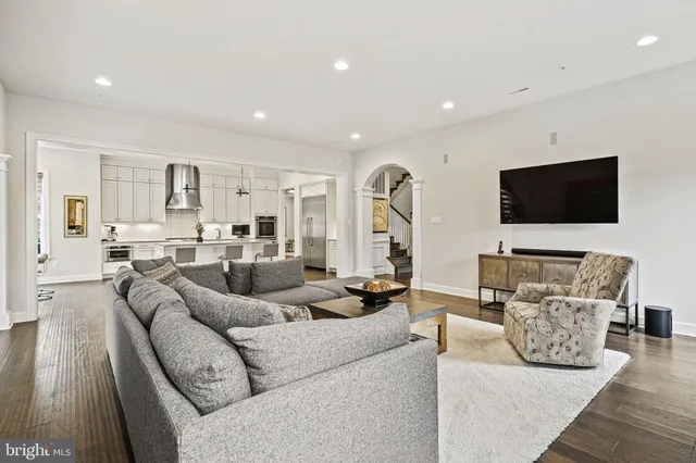 a living room with furniture window and wooden floor