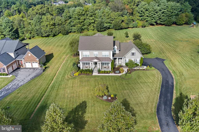an aerial view of a house with a garden