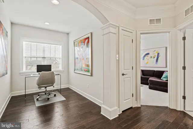 a bedroom with a bed and the view of bathroom