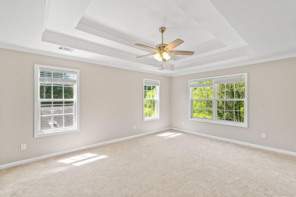 473 Greyhawk Way Fairburn, GA 30213 - Photo 22 of 34 an empty room with windows and fan