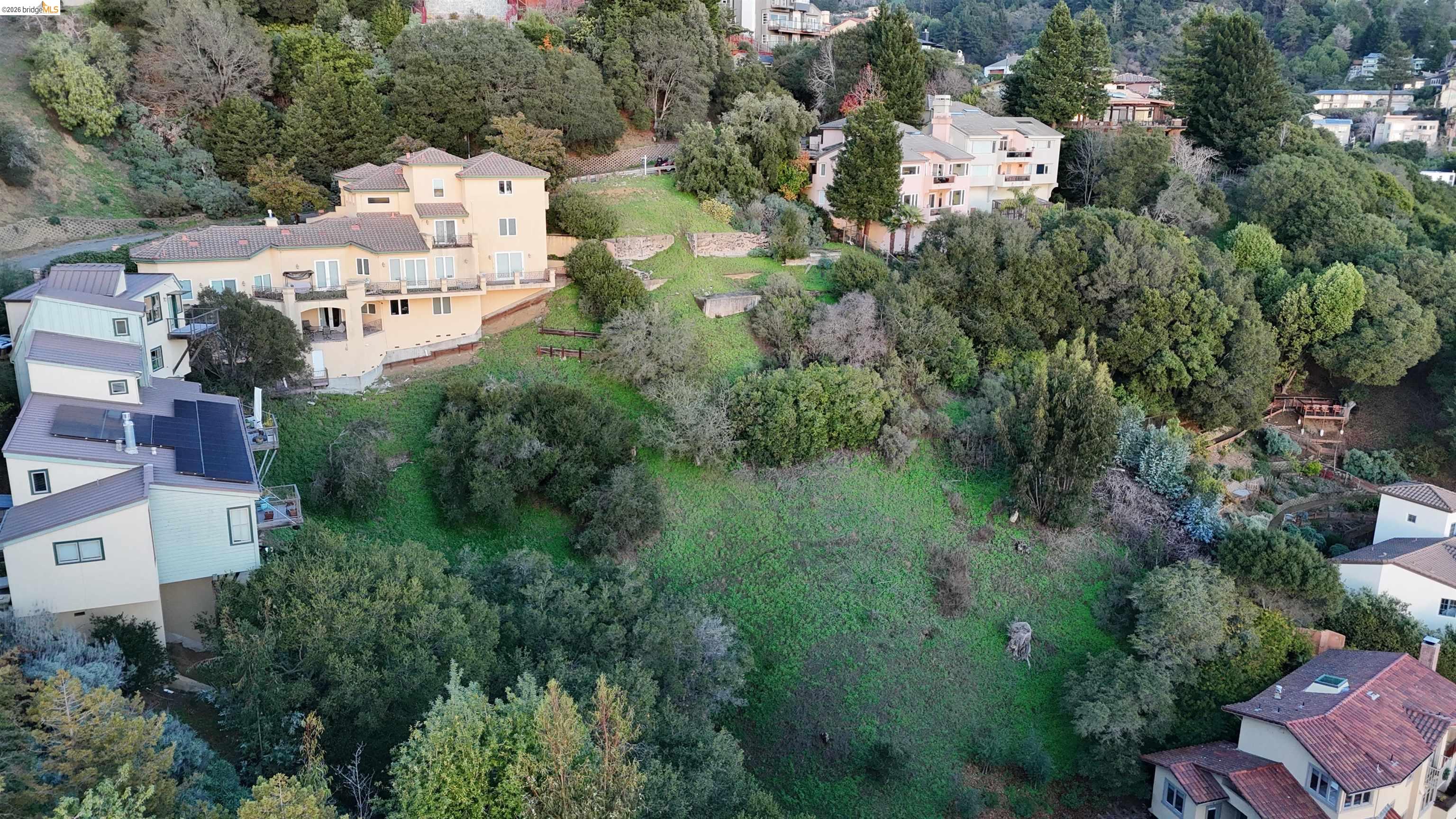 142 Gravatt Drive Berkeley, CA 94705 - Photo 13 of 25 an aerial view of a house with outdoor space and trees all around