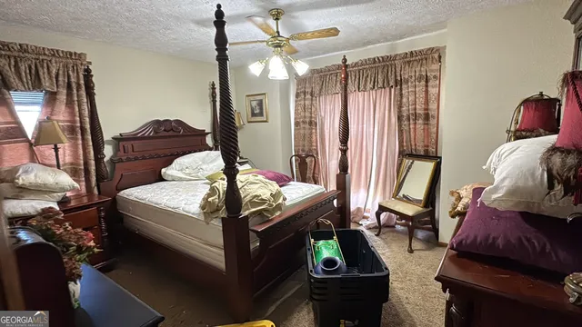 a view of a swimming pool with a yard