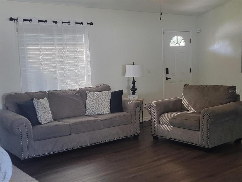 2523 Southwest 147 Place Road Ocala, FL 34473 - Photo 2 of 15 a living room with furniture and a window