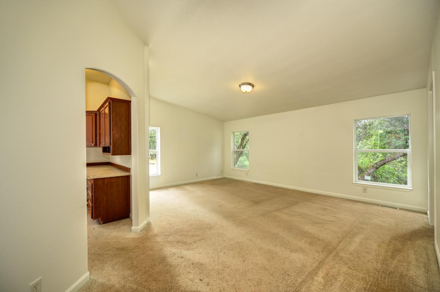 3680 Greenwood Road Garden Valley, CA 95633 - Photo 11 of 32 an empty room with windows and closet