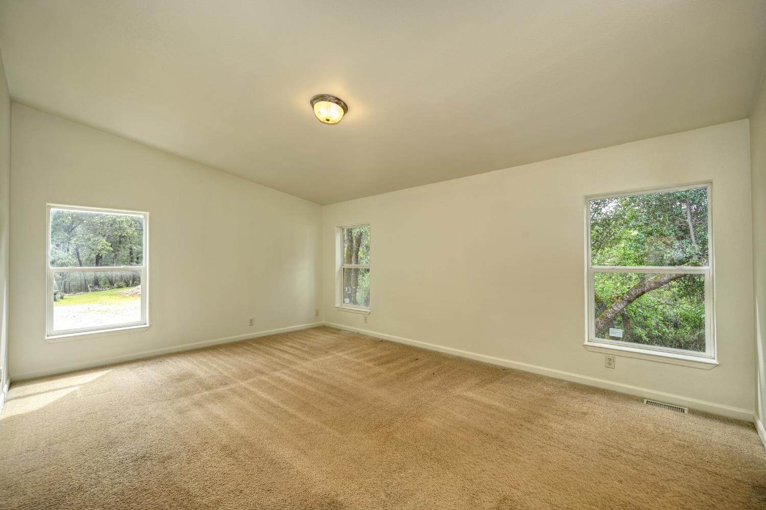 3680 Greenwood Road Garden Valley, CA 95633 - Photo 10 of 32 an empty room with windows