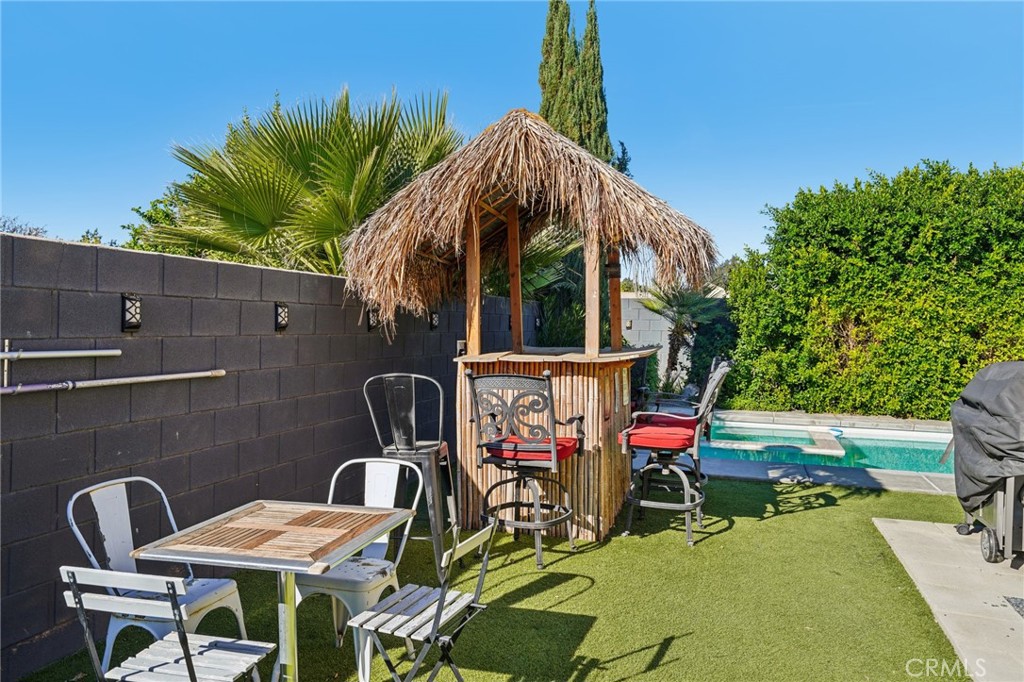 83290 Mango Walk Indio, CA 92201 - Photo 21 of 31 a view of balcony with two chairs and a table