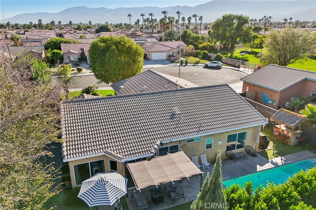 83290 Mango Walk Indio, CA 92201 - Photo 23 of 31 an aerial view of a house with garden space and street view