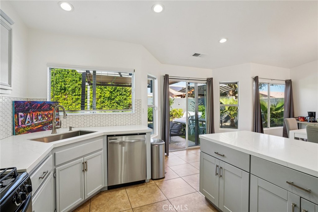 83290 Mango Walk Indio, CA 92201 - Photo 8 of 31 a kitchen with a sink and cabinets