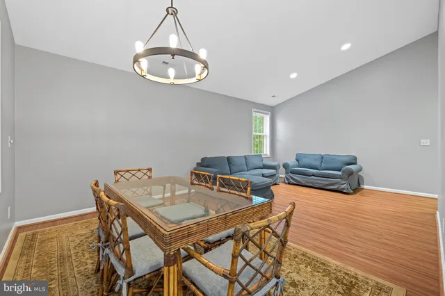 a living room with a table and chairs