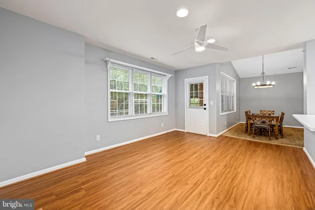 a view of a livingroom with furniture and wooden floor