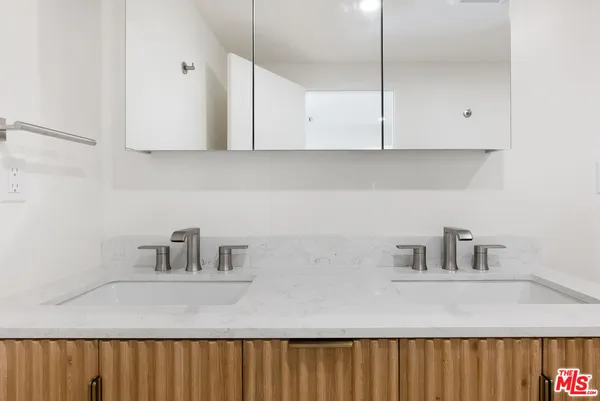 a kitchen with cabinets and white appliances