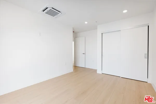 a view of hallway with a white walls