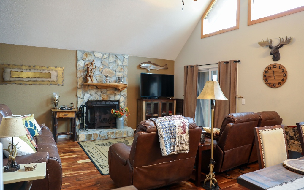 96 Indigo Ridge Murphy, NC 28906 - Photo 11 of 26 a living room with furniture a flat screen tv and a fireplace