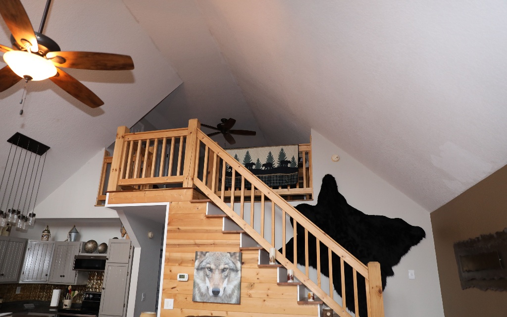 96 Indigo Ridge Murphy, NC 28906 - Photo 24 of 26 a view of staircase with lots of frames on wall and a window