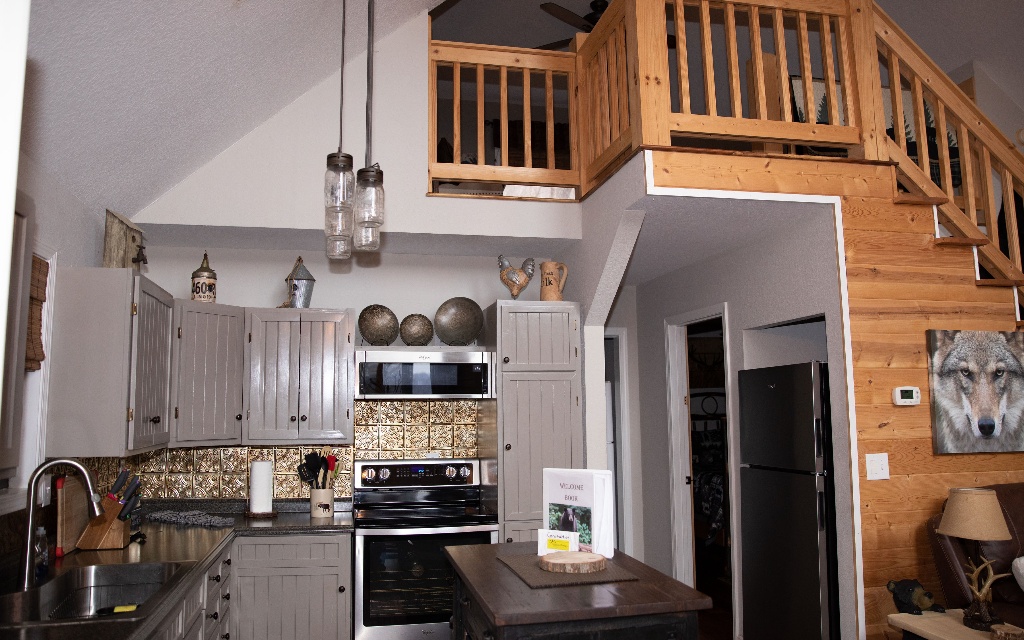96 Indigo Ridge Murphy, NC 28906 - Photo 25 of 26 a kitchen with stainless steel appliances granite countertop a stove and cabinets