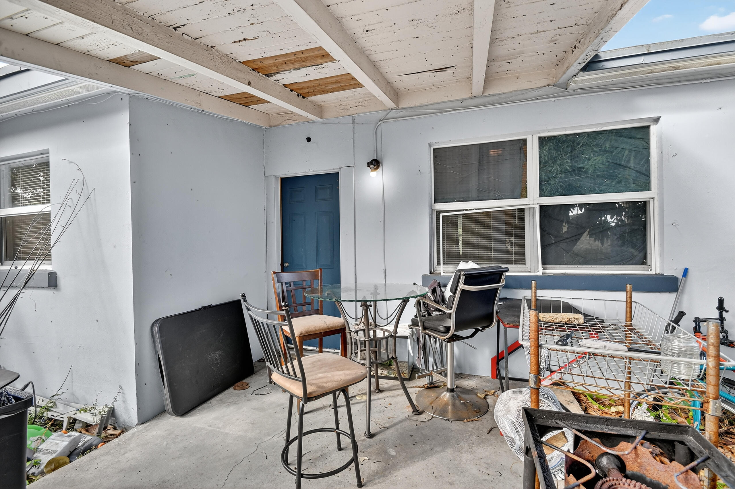 173 West 18th Street Riviera Beach, FL 33404 - Photo 20 of 28 a view of a dining room with furniture and windows
