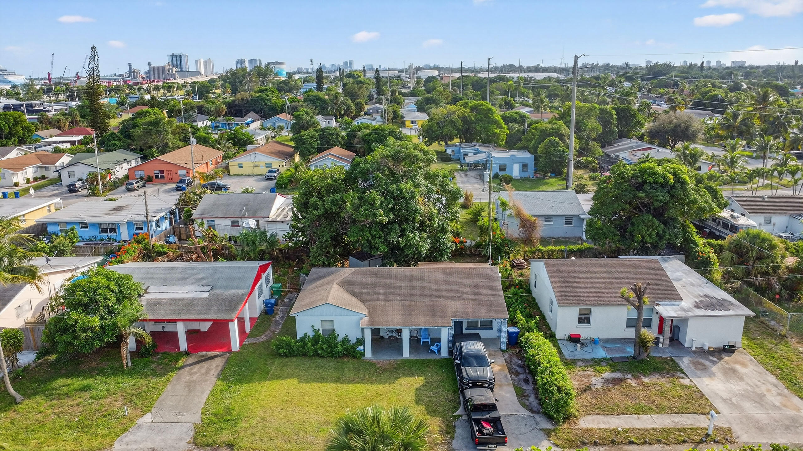 173 West 18th Street Riviera Beach, FL 33404 - Photo 26 of 28 an aerial view of a house with a garden and lake view