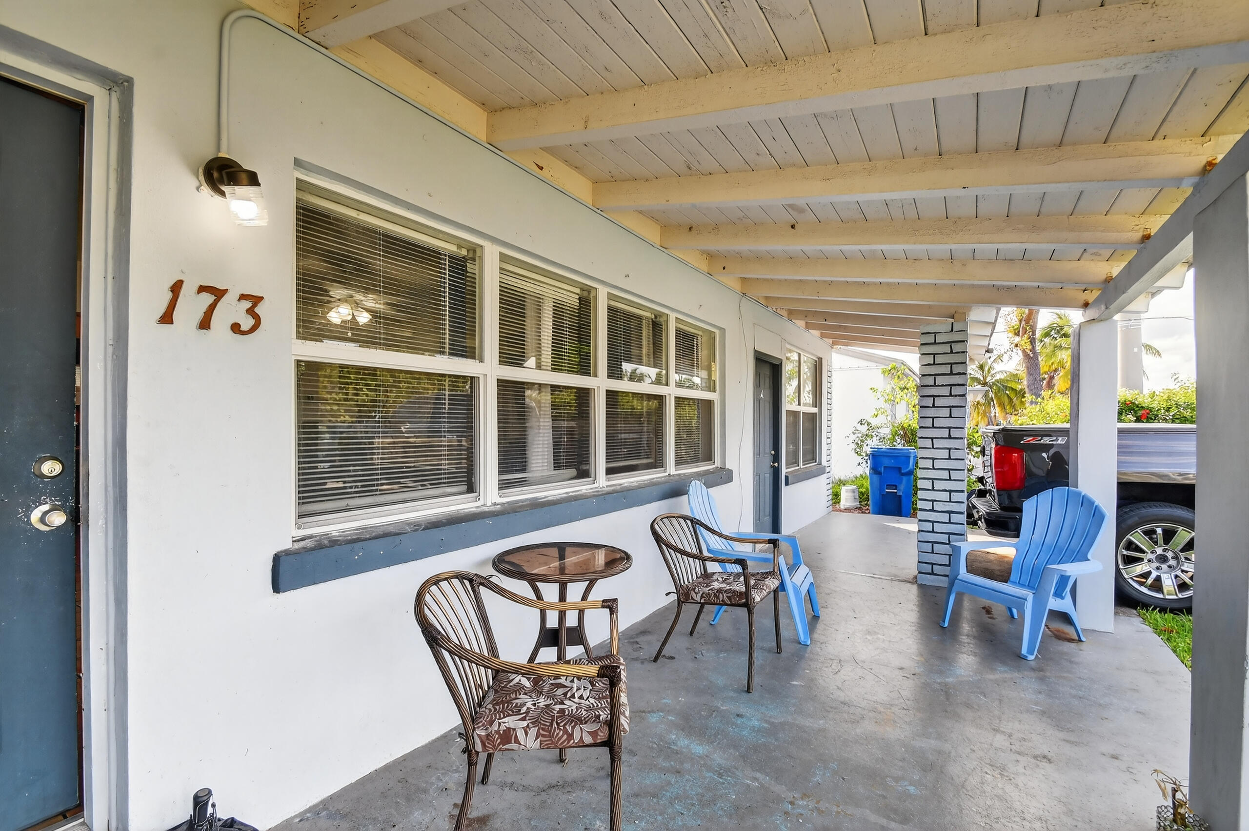 173 West 18th Street Riviera Beach, FL 33404 - Photo 4 of 28 a living room with furniture and floor to ceiling window