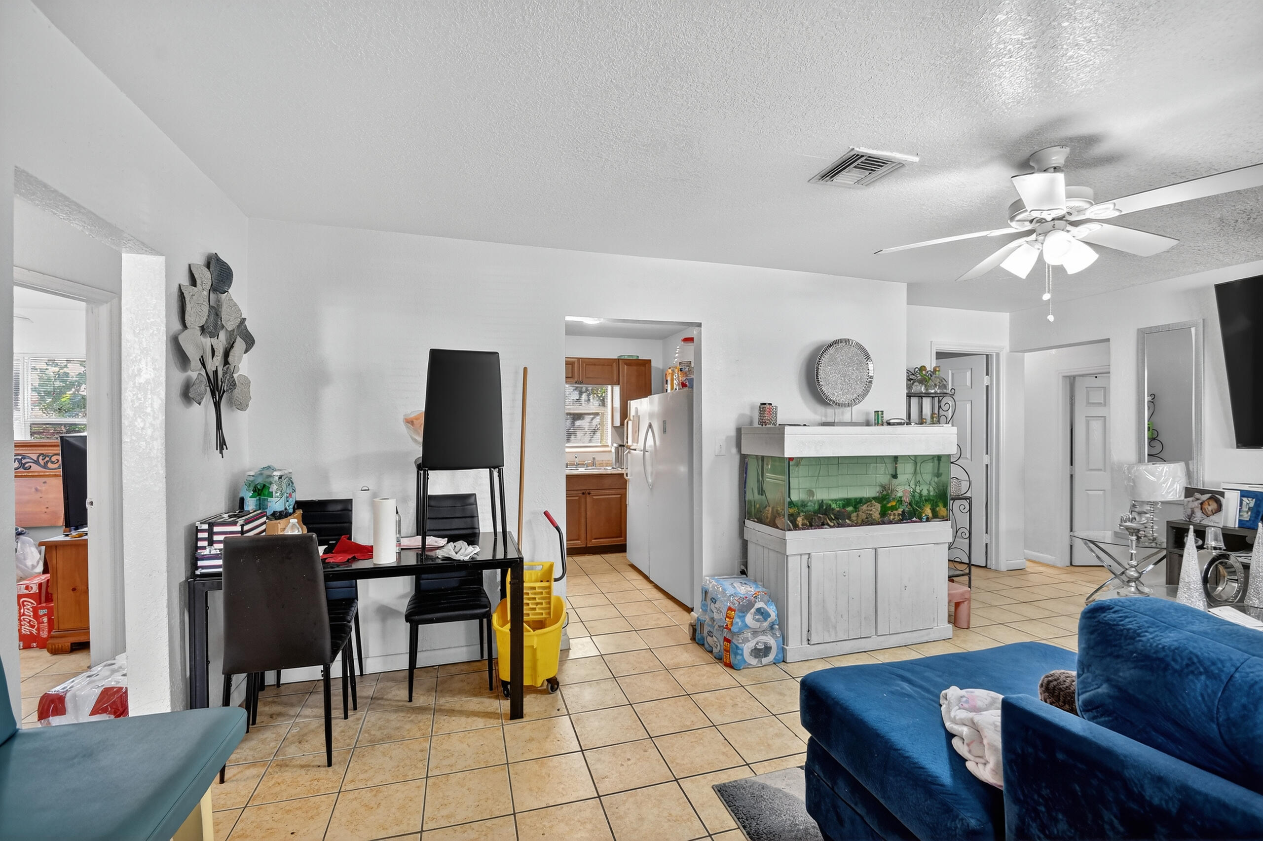 173 West 18th Street Riviera Beach, FL 33404 - Photo 7 of 28 a living room with furniture and a flat screen tv