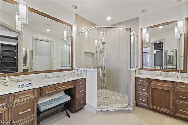 a bathroom with a granite countertop sink mirror and double