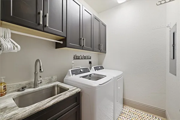a bathroom with a sink and cabinets