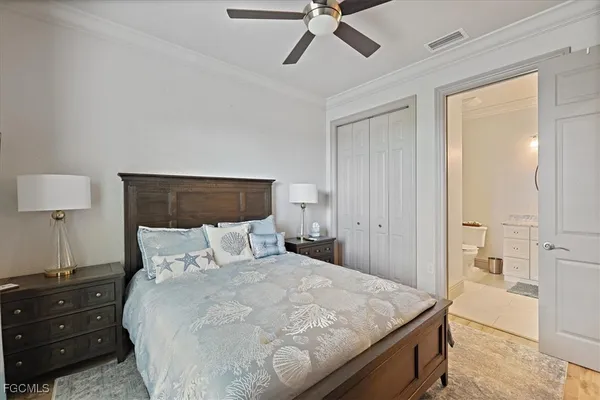 a bedroom with a bed and a closet