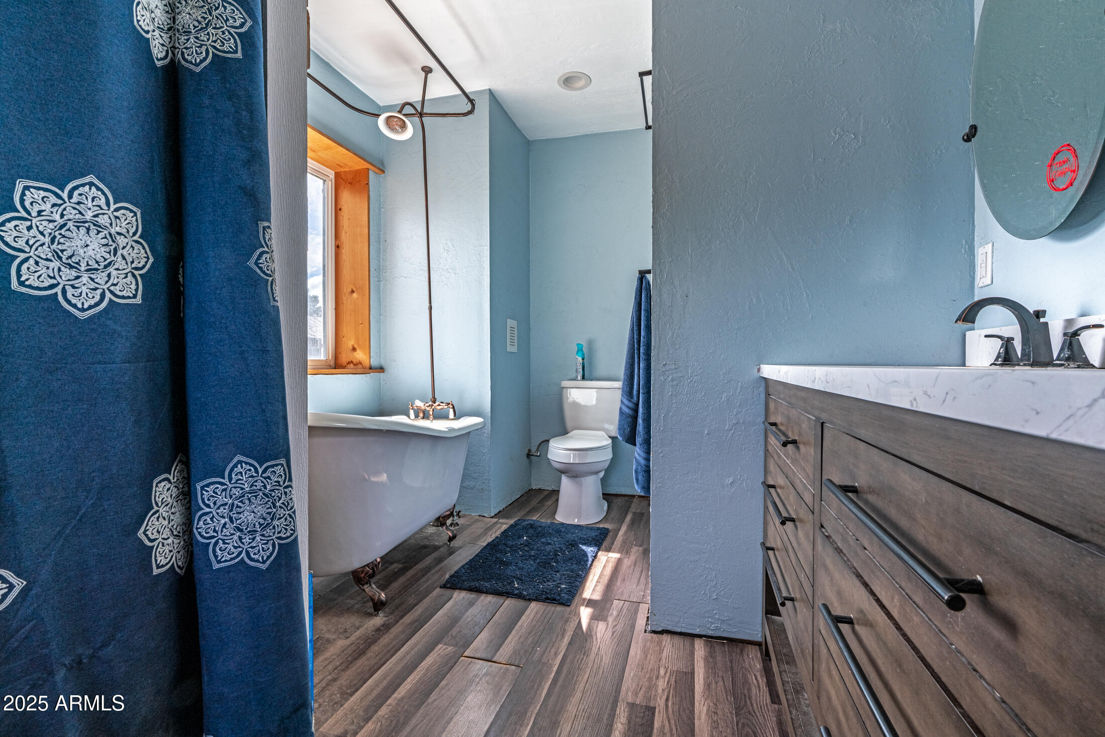 4933 Sawmill Road Clay Springs, AZ 85923 - Photo 11 of 14 a bathroom with a sink and a mirror
