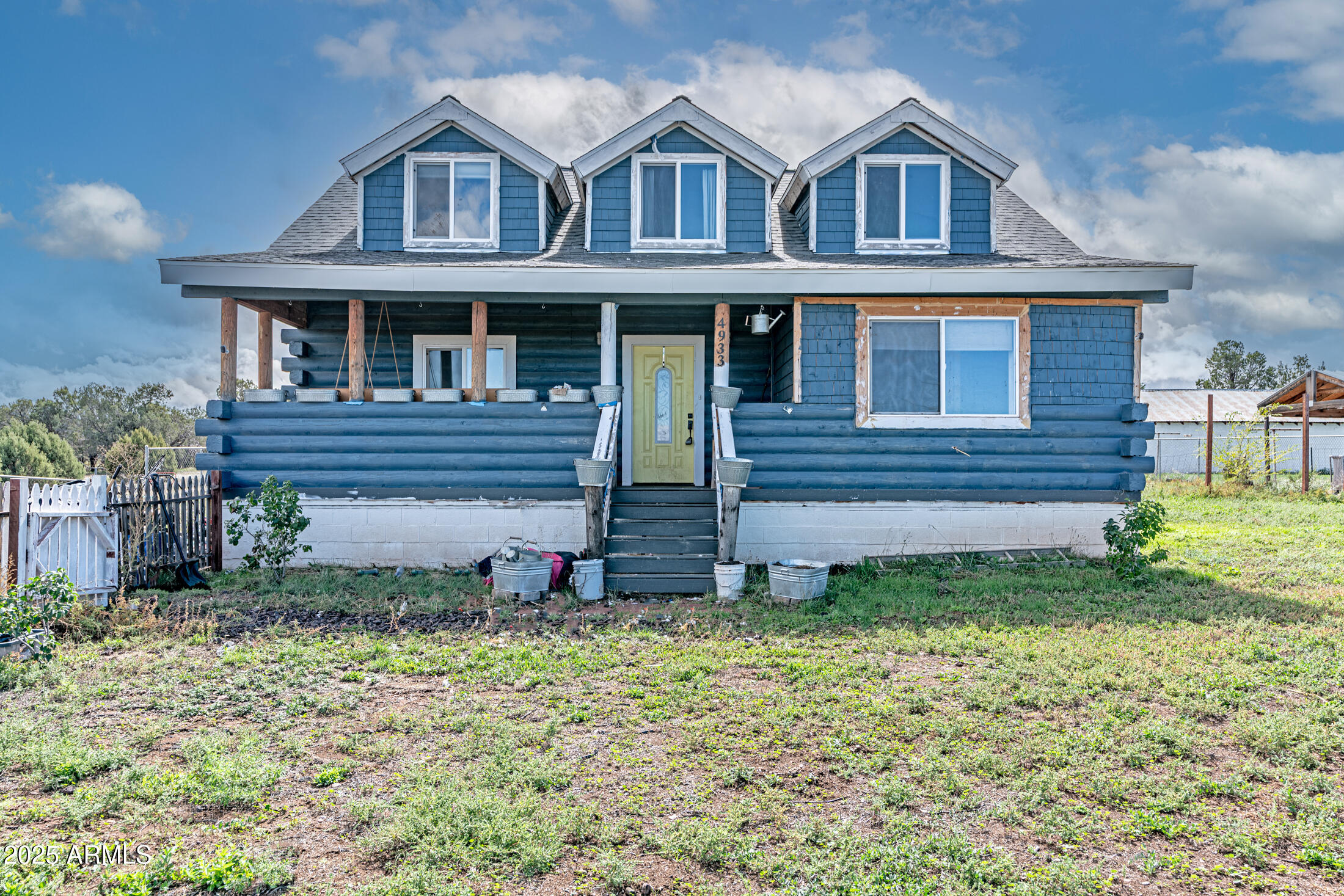 4933 Sawmill Road Clay Springs, AZ 85923 - Photo 14 of 14 a front view of a house with garden