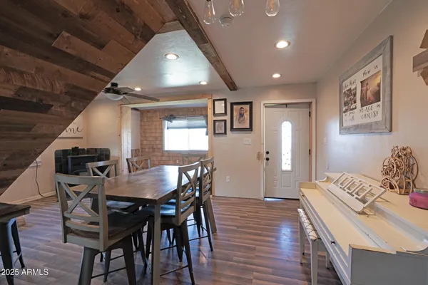 a dining room with furniture and window