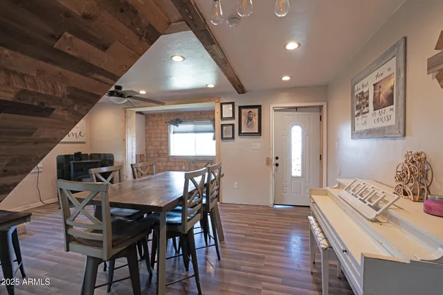 a dining room with furniture and window