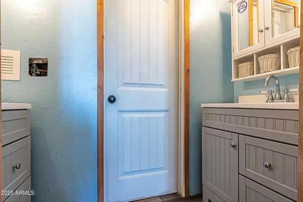 a bathroom with a sink and a mirror