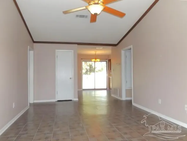 a view of an empty room with a window
