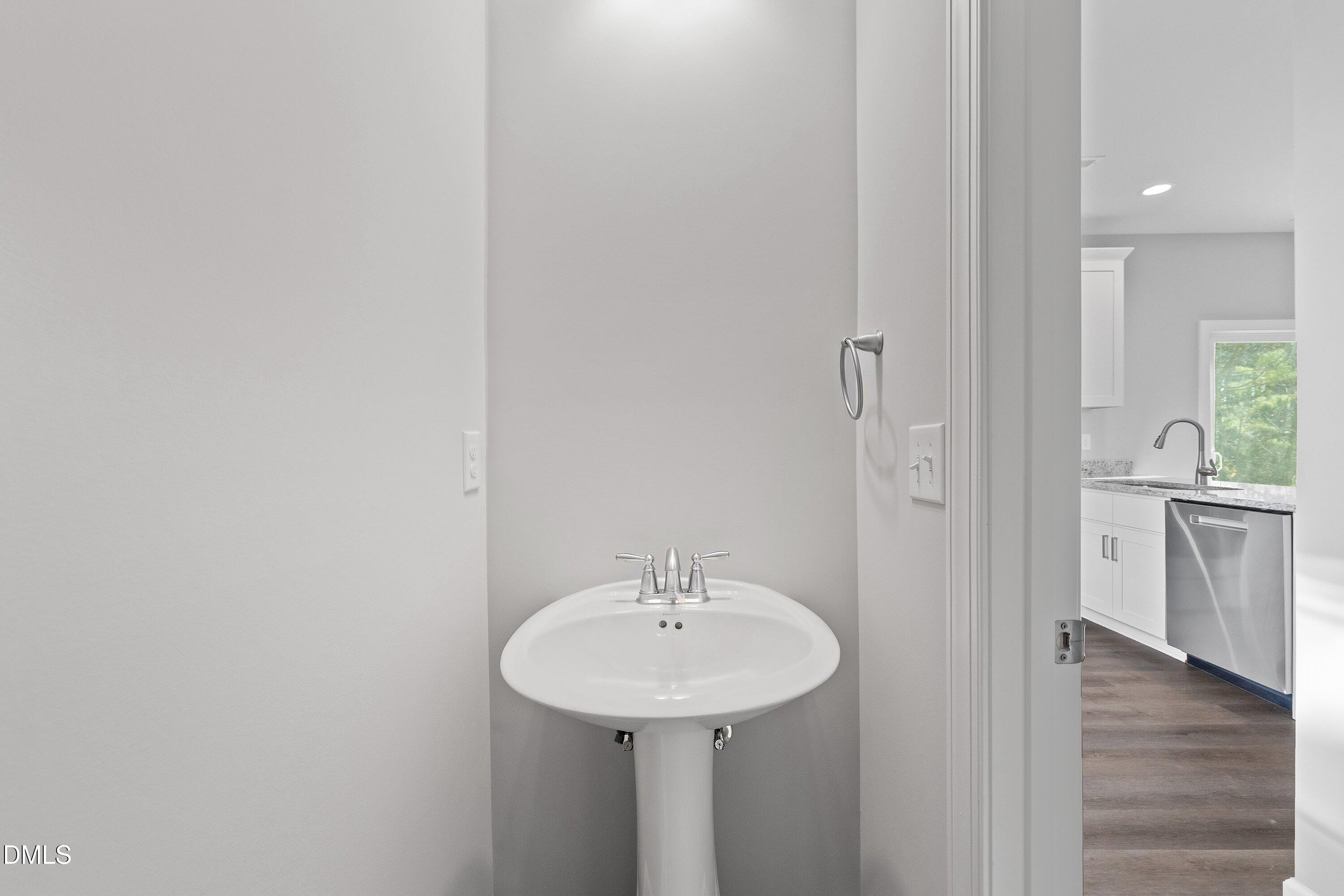 1804 Falls Landing Drive Raleigh, NC 27614 - Photo 15 of 20 a bathroom with a sink and a mirror