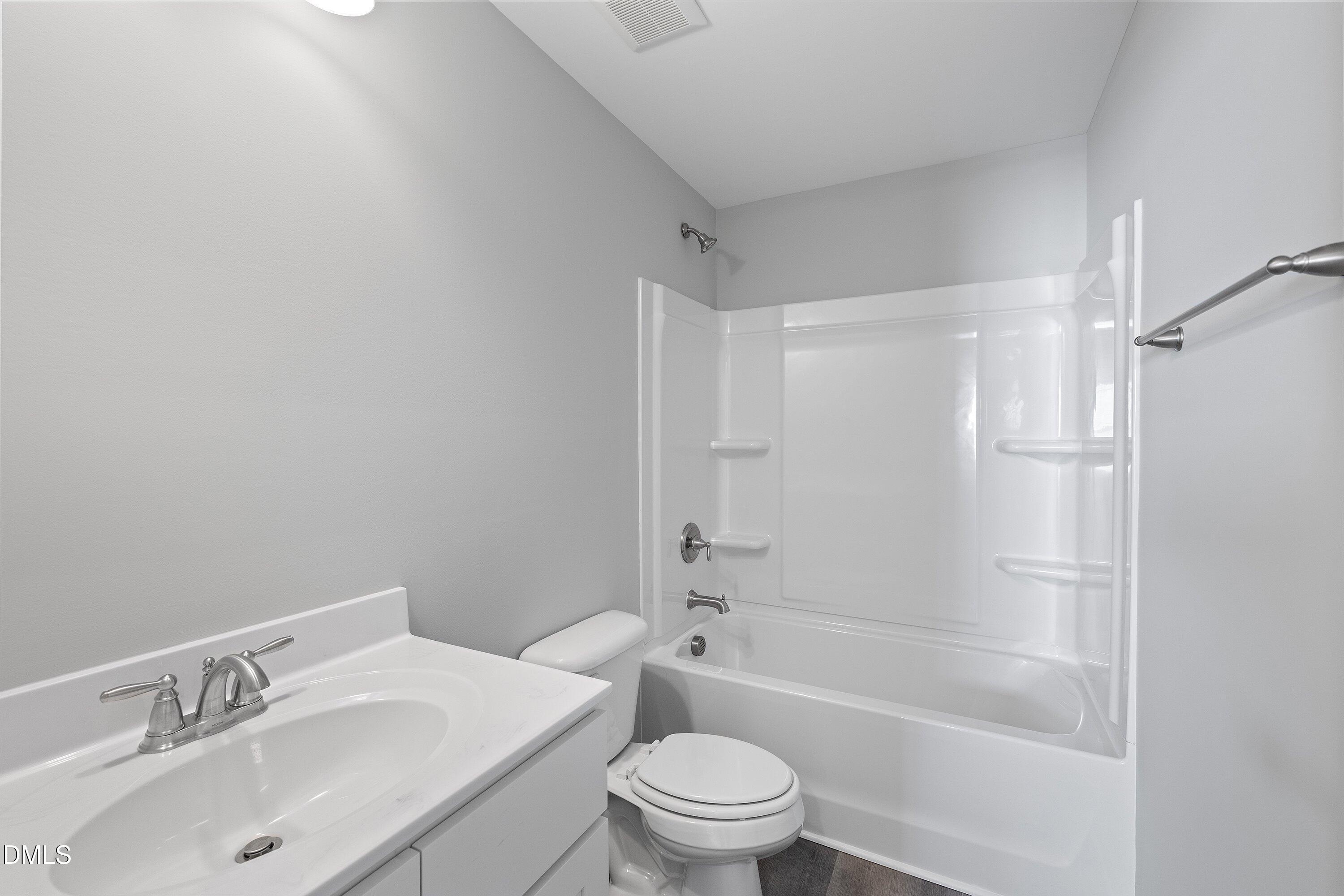 1804 Falls Landing Drive Raleigh, NC 27614 - Photo 18 of 20 a bathroom with a sink toilet and shower