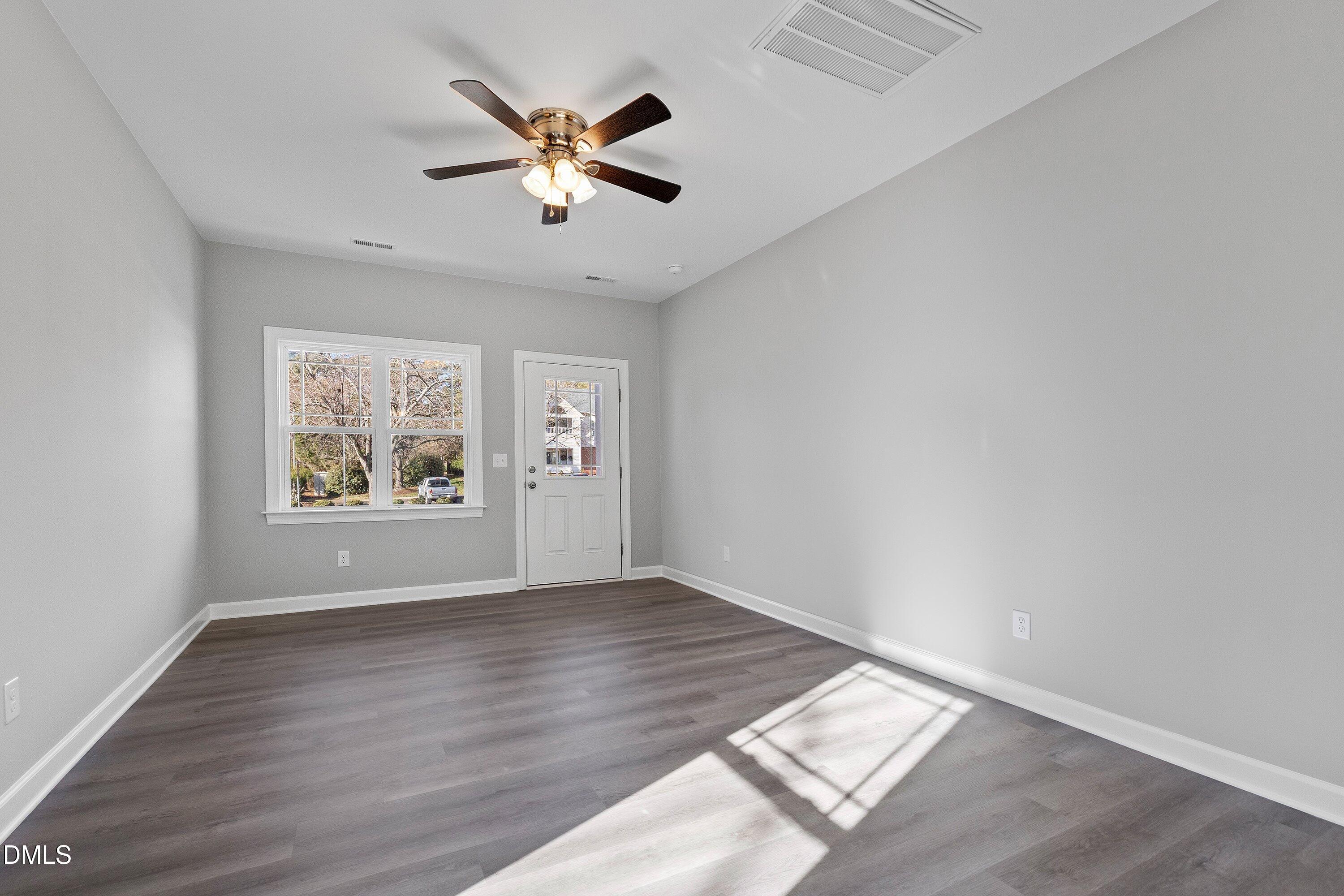 1804 Falls Landing Drive Raleigh, NC 27614 - Photo 4 of 20 wooden floor in an empty room with a window